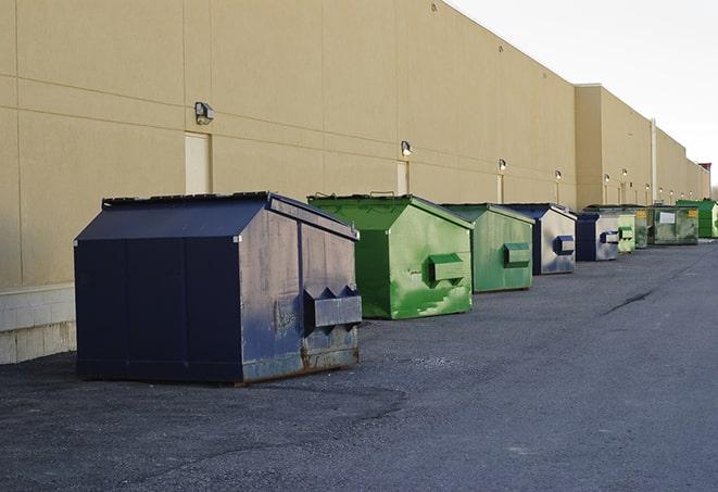 a row of industrial dumpsters for construction waste in Ridgetop, TN